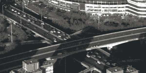A cityscape, with evermoving cars and highrises, particularly in Beijing the biggest city in the world.