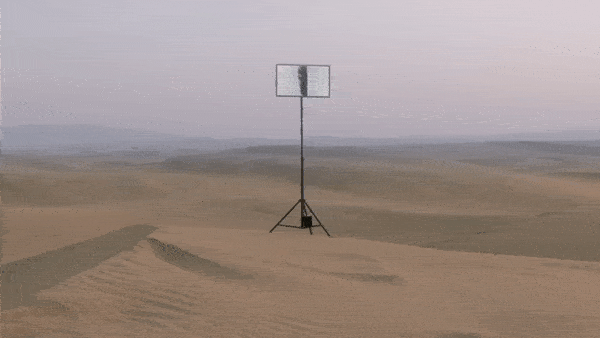 A television screen looping an abstract vision. It is mounted in a desert, contrasting the sands of time with the ever-changing channel hopping nature of media.